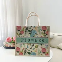 Women's Medium Cotton And Linen Letter Flower Streetwear Magnetic Buckle Tote Bag main image video