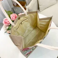 Women's Medium Cotton And Linen Letter Flower Streetwear Magnetic Buckle Tote Bag main image 2